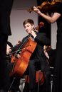 Man in Black Suit Playing Violin