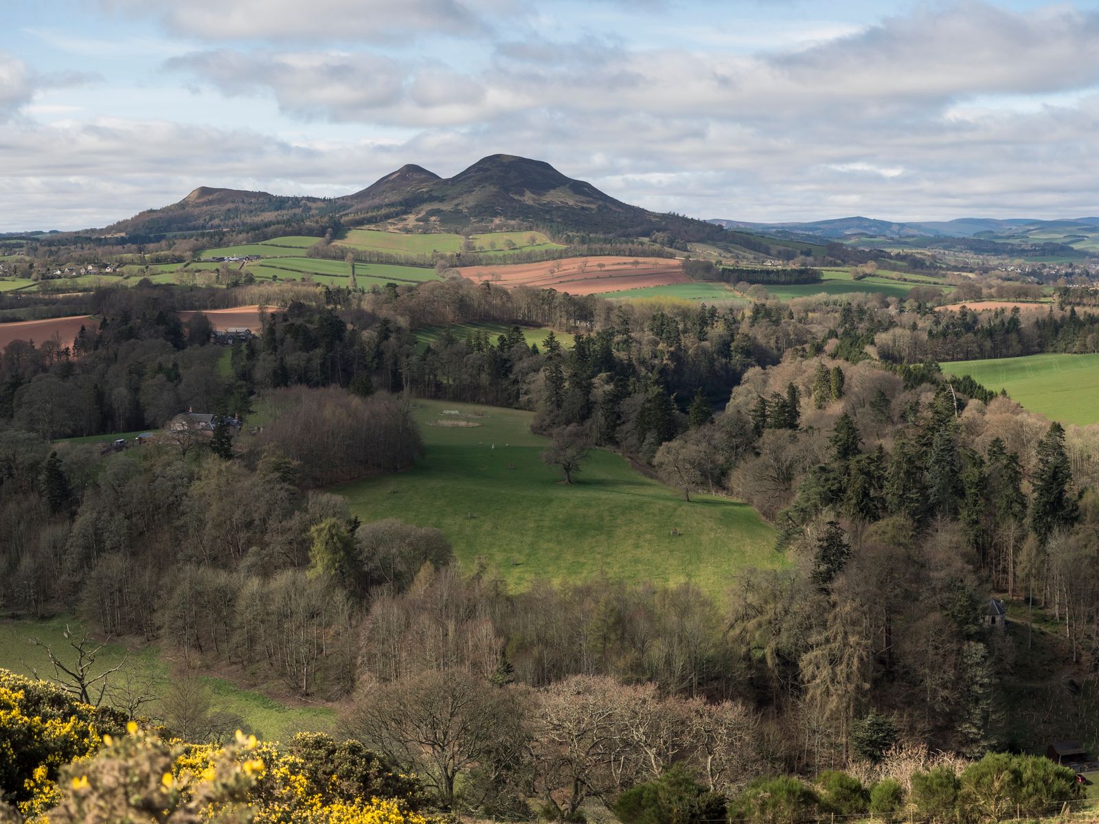 The Eildon Hills rising above farmland in the Scottish Borders