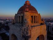 A stunning aerial shot of Monumento a la Revolución in Mexico City during twilight, showcasing its architectural details.