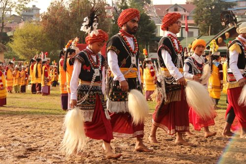 Free Vibrant Indian festival with men and women in traditional attire celebrating outdoors. Stock Photo