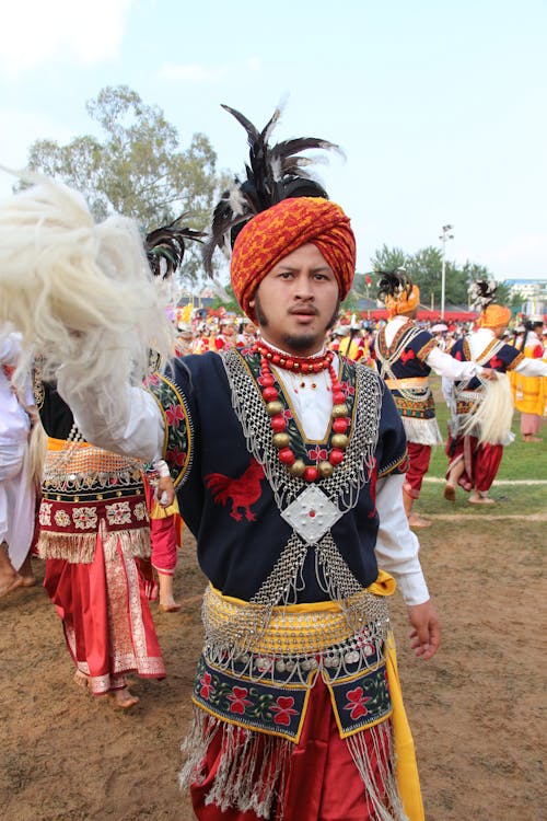 Free A Man in Traditional Wear in a Parade Stock Photo