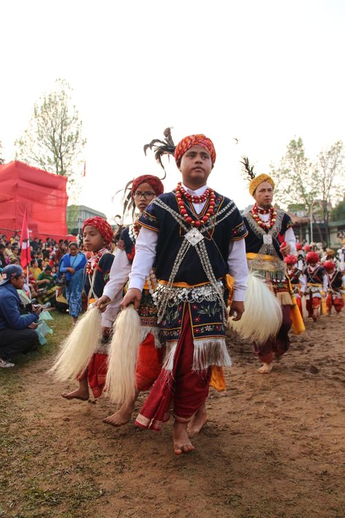 Free Colorful traditional dance festival with performers in vibrant costumes and cultural attire. Stock Photo