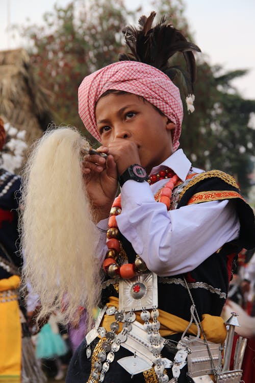 Boy Playing Instrument