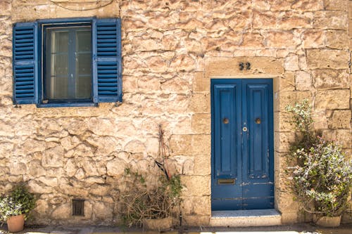 Blue Wooden Door and Window of a House