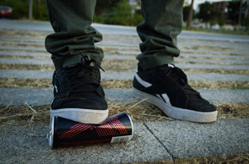 Free A Person Wearing a Black Sneakers Stock Photo