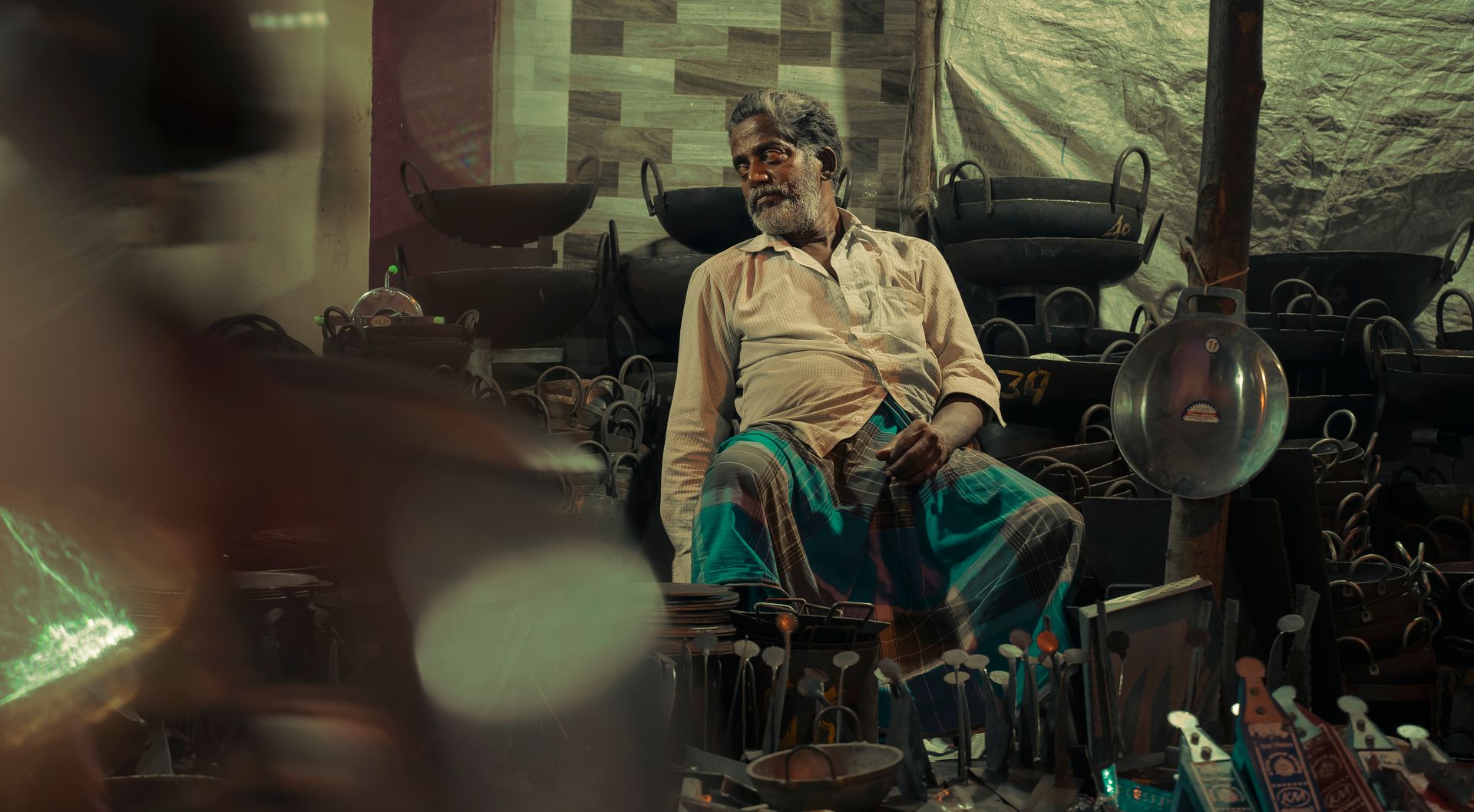A Man Sitting in a Store