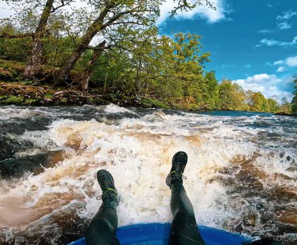 Person Riding Rapids