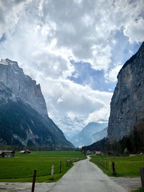 Paved Pathway between Mountains