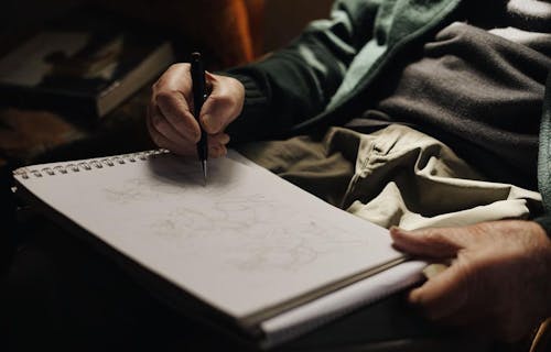 Photo of a Person Drawing