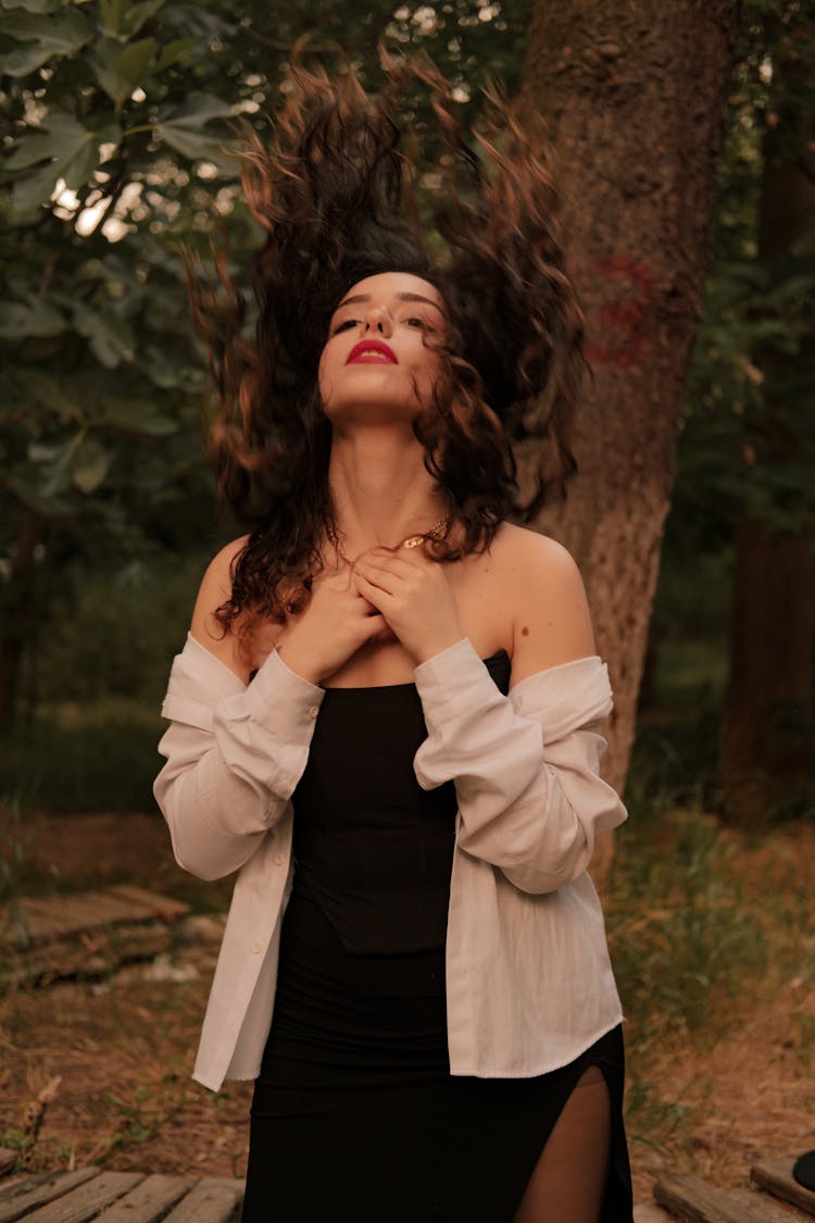 A Woman Holding Her Necklace