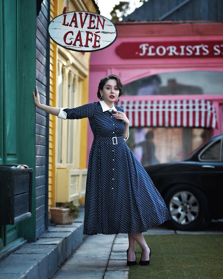 Woman Wearing Retro Dress Outside Cafe