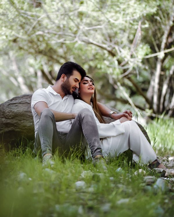 Romantic Couple Cuddle Outdoors · Free Stock Photo