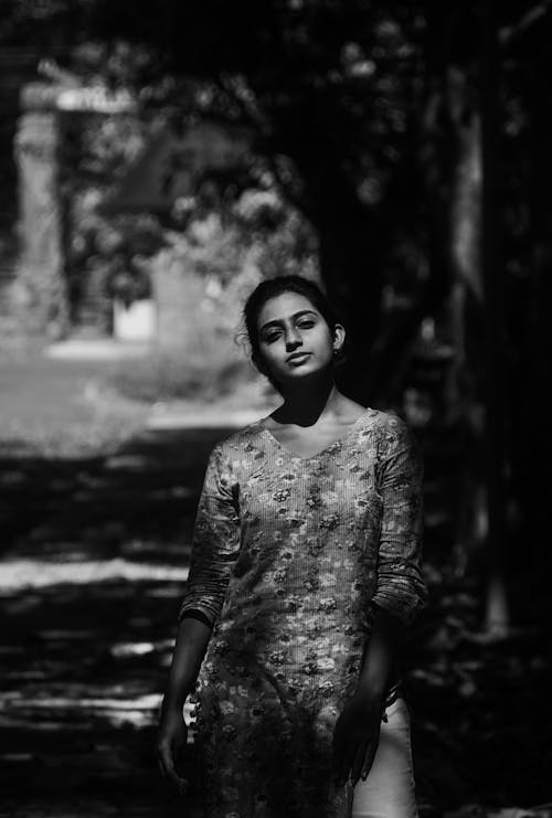 Grayscale Photo of a Woman Wearing Floral Blouse