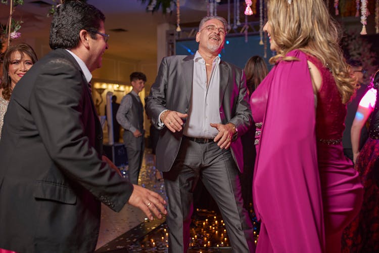 People Dancing And Laughing At A Party 