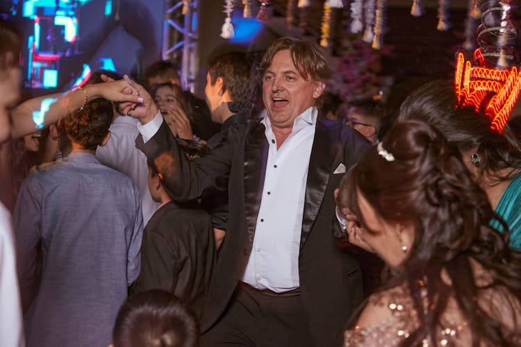 Man In Full Suit Dancing In Nightclub