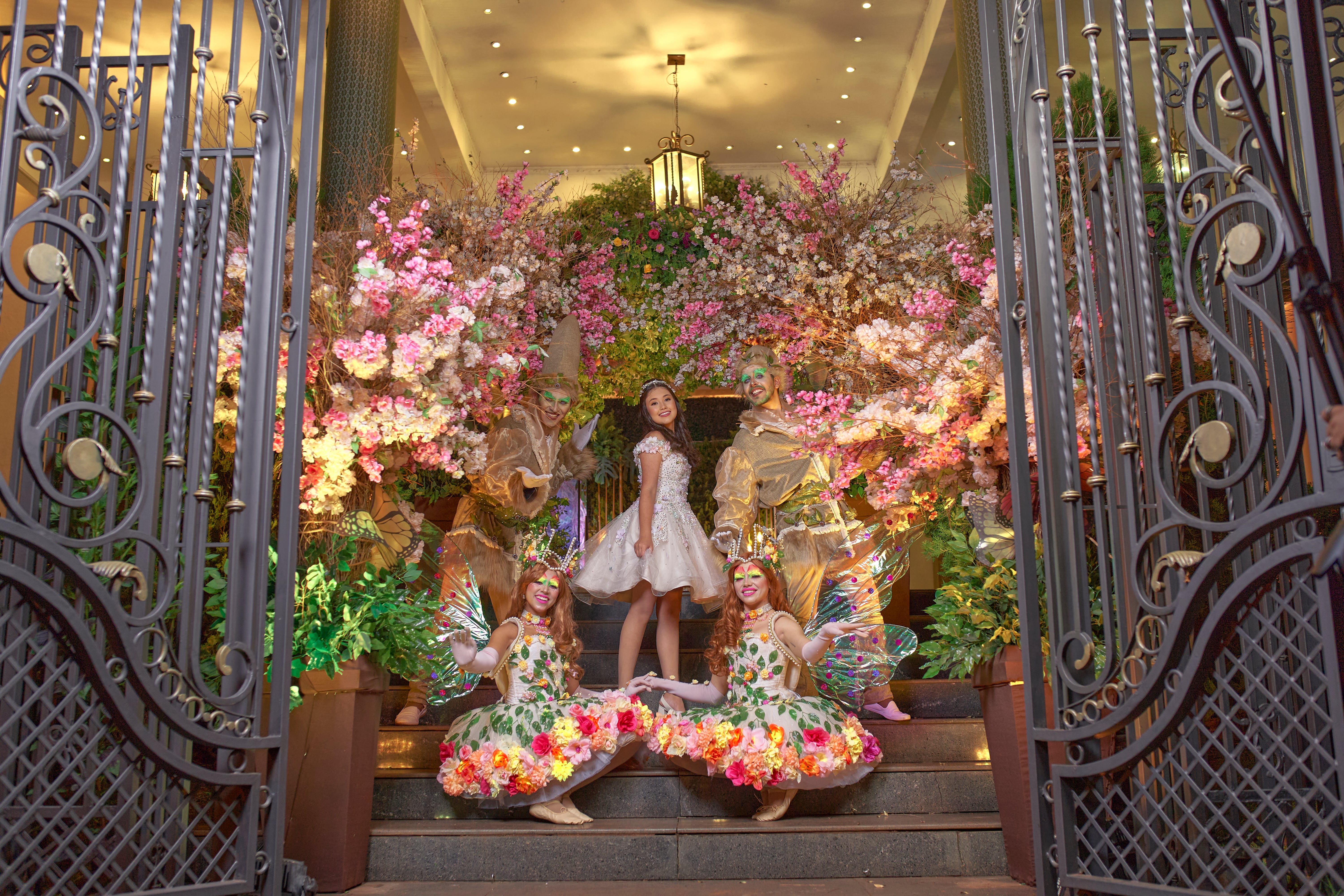 young girls posing on the entrance doorway wearing fairy costumes