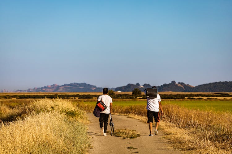 Men Hiking In Countryside