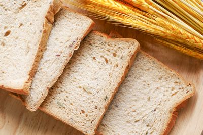 Sliced whole grain bread with wheat ears — photo by Towfiqu barbhuiya on Pexels