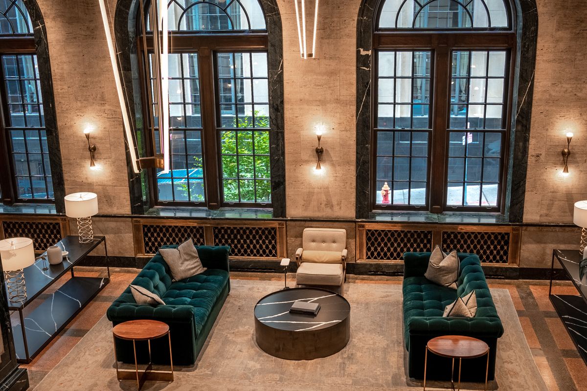 Spacious hotel lobby with contemporary furniture and lighting