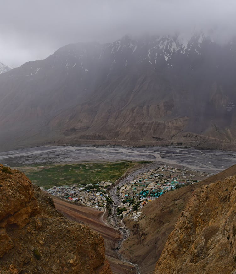 Town Near River In Mountains