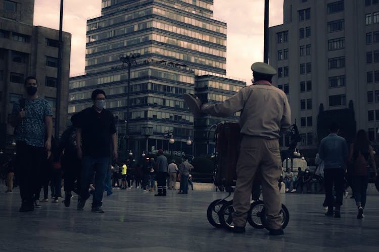 People In Masks On Square In City