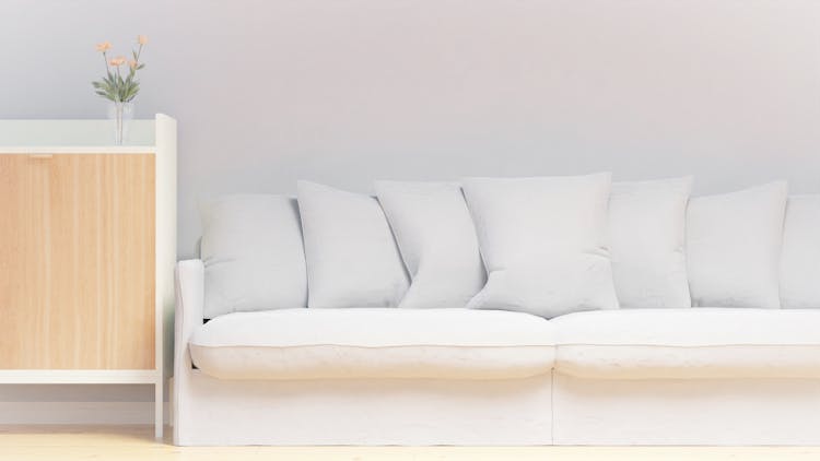 A White Sofa Beside A Side Table