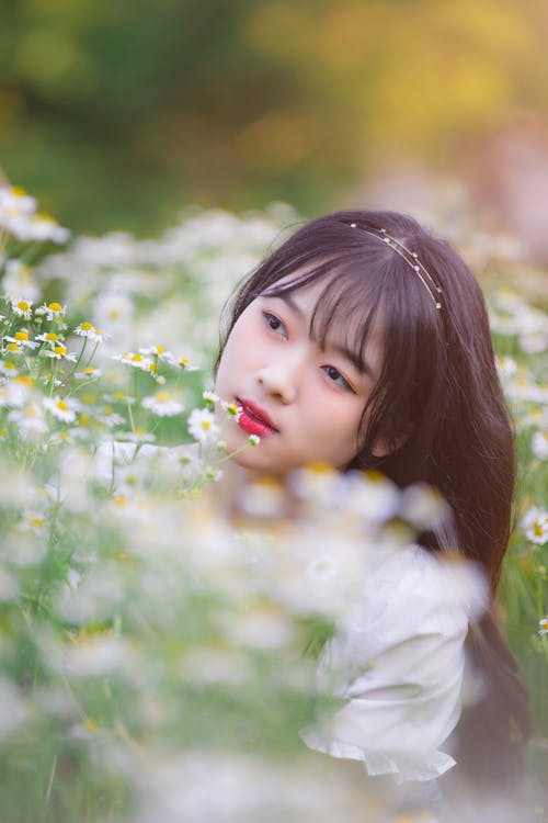 White Flowers near Woman's Face