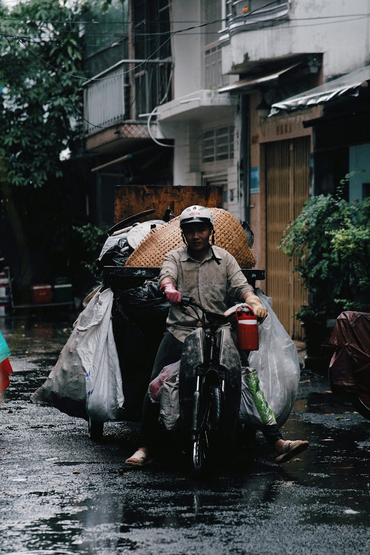 A Man Riding A Tricycle