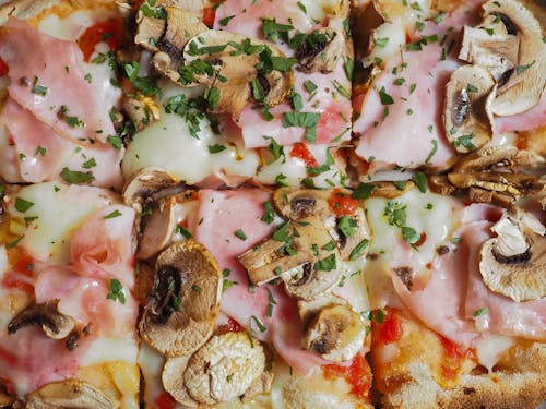 Pizza With Ham and Mushroom Toppings