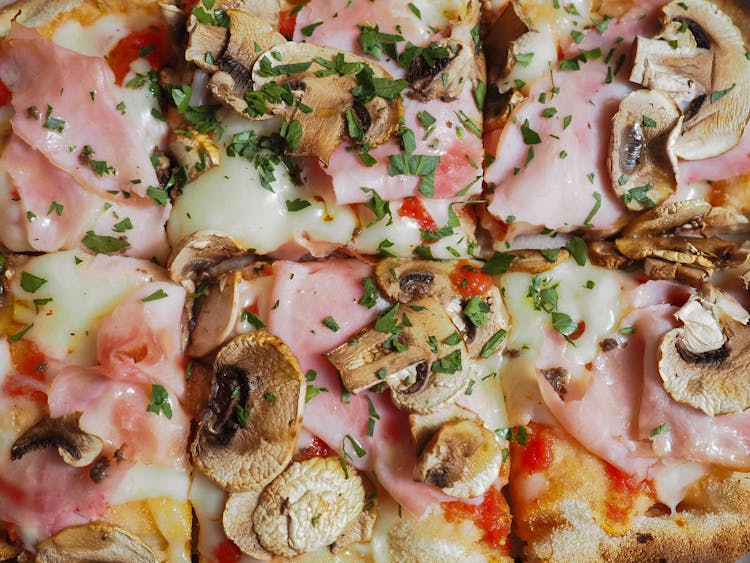 Pizza With Ham And Mushroom Toppings