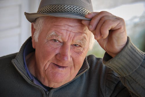 A Man Wearing Gray Fedora Hat