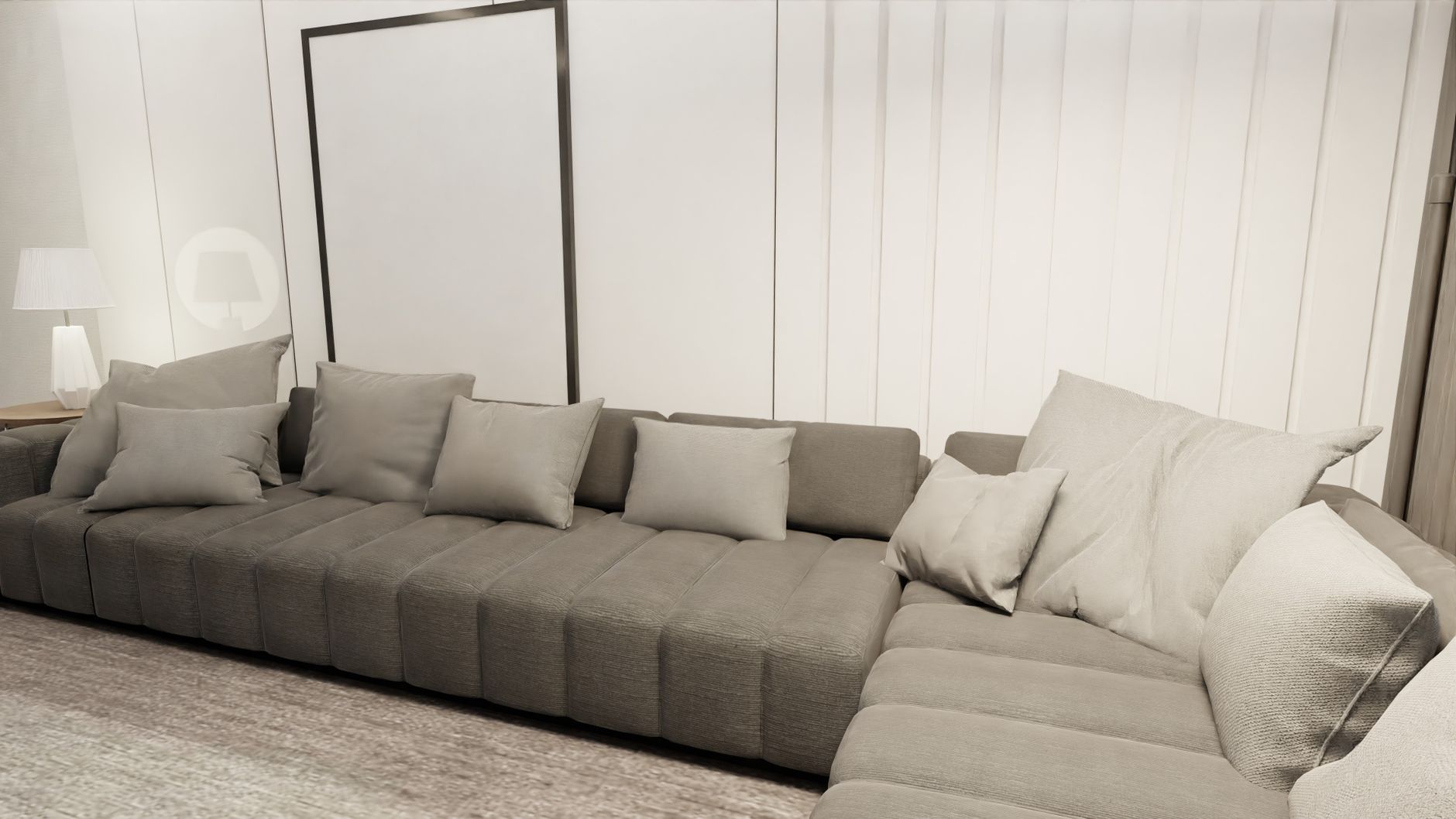 Elegant modern living room featuring a large gray sofa and minimalist decor for a cozy ambiance.