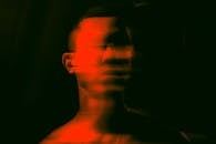 Blurred Portrait of a Man in Red Lighting