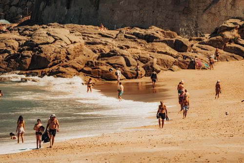 Free A vibrant beach scene at Riazor Beach, Galicia, with people enjoying a sunny day by the shore. Stock Photo