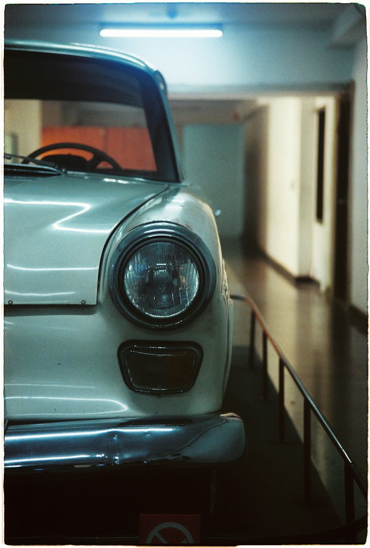 White Vintage Car Parked On The Garage