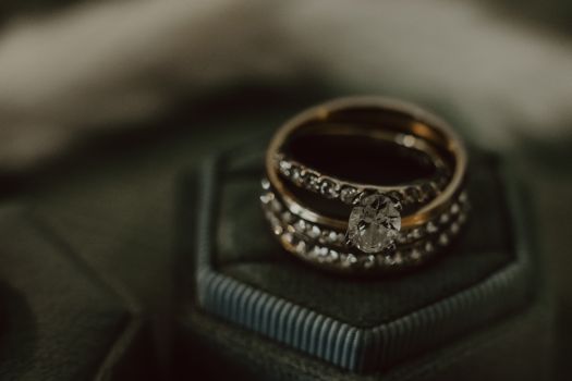 Close-up of a dazzling diamond ring set on a luxurious velvet box, showcasing elegance.