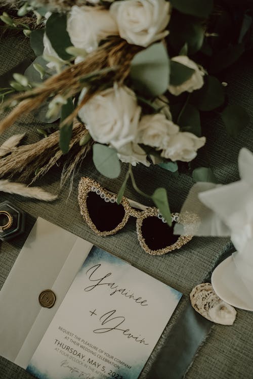 Wedding Invitation and Souvenirs on a Table