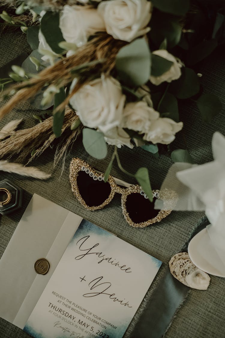 Wedding Invitation And Souvenirs On A Table