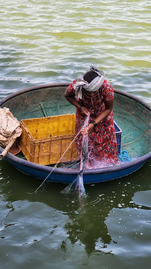 A Woman Pulling a Fishing Net