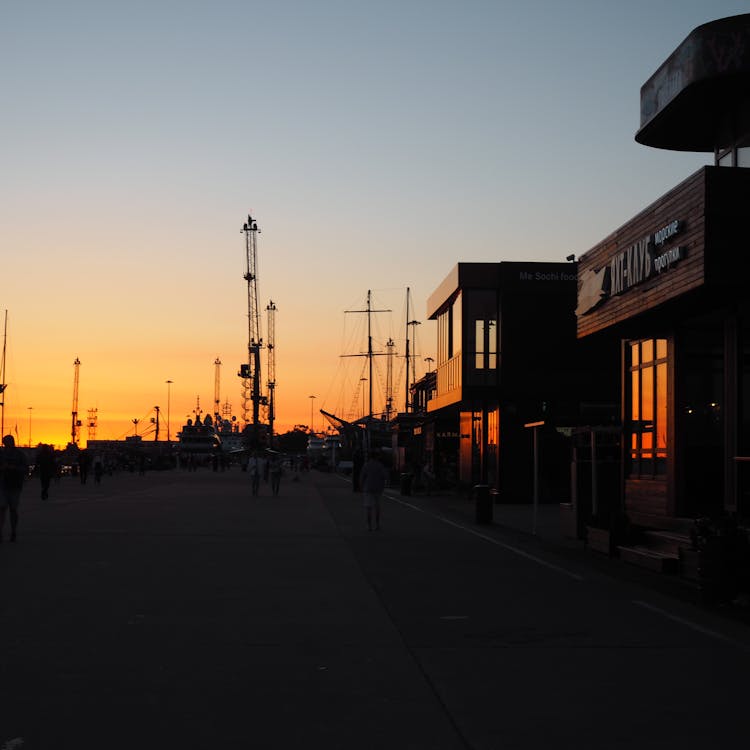 Clear Sky Over Promenade In Town At Sunset