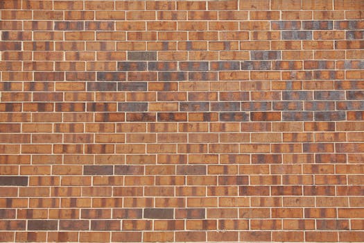 A close-up of a red brick wall with intricate patterns and textures, ideal for backgrounds.