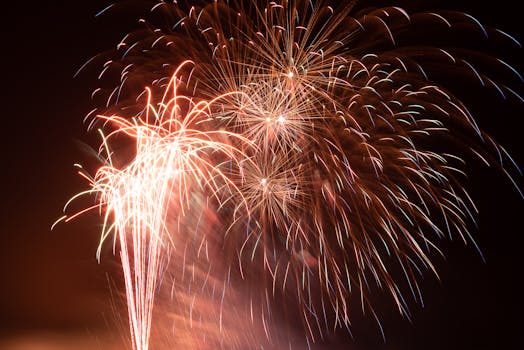 Bright and colorful fireworks illuminate the night sky with a stunning display of pyrotechnics.