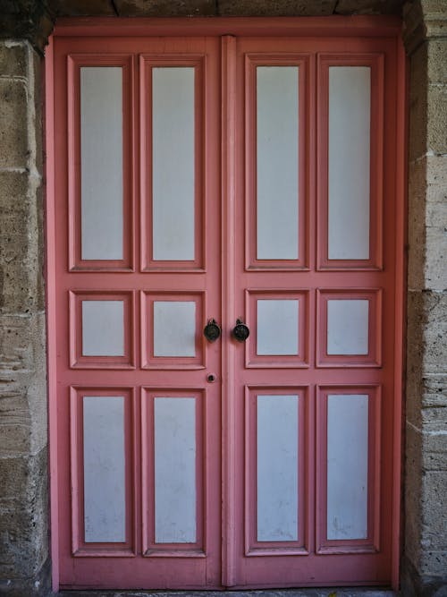 Free Old Pink Wooden Door of a House Stock Photo