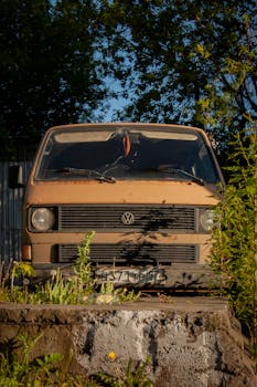 Front view of a classic Volkswagen van parked outdoors in Moscow, surrounded by greenery.