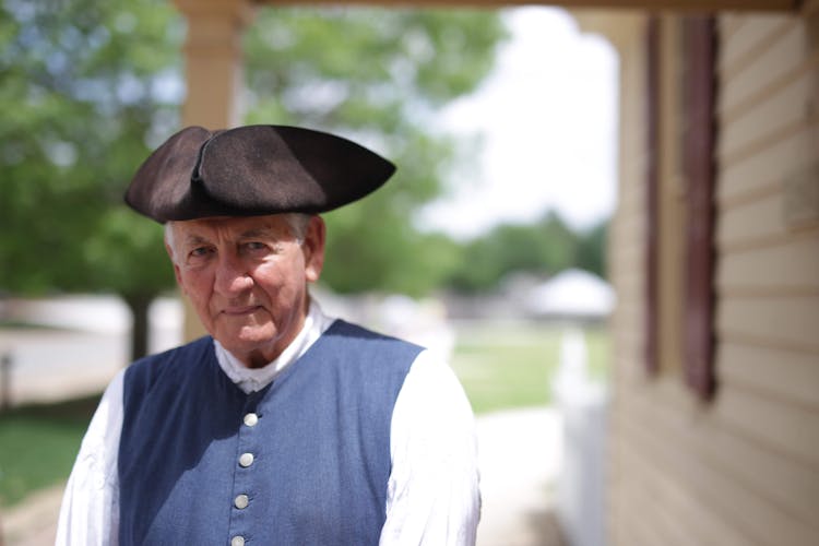 Man In Hat And Vest