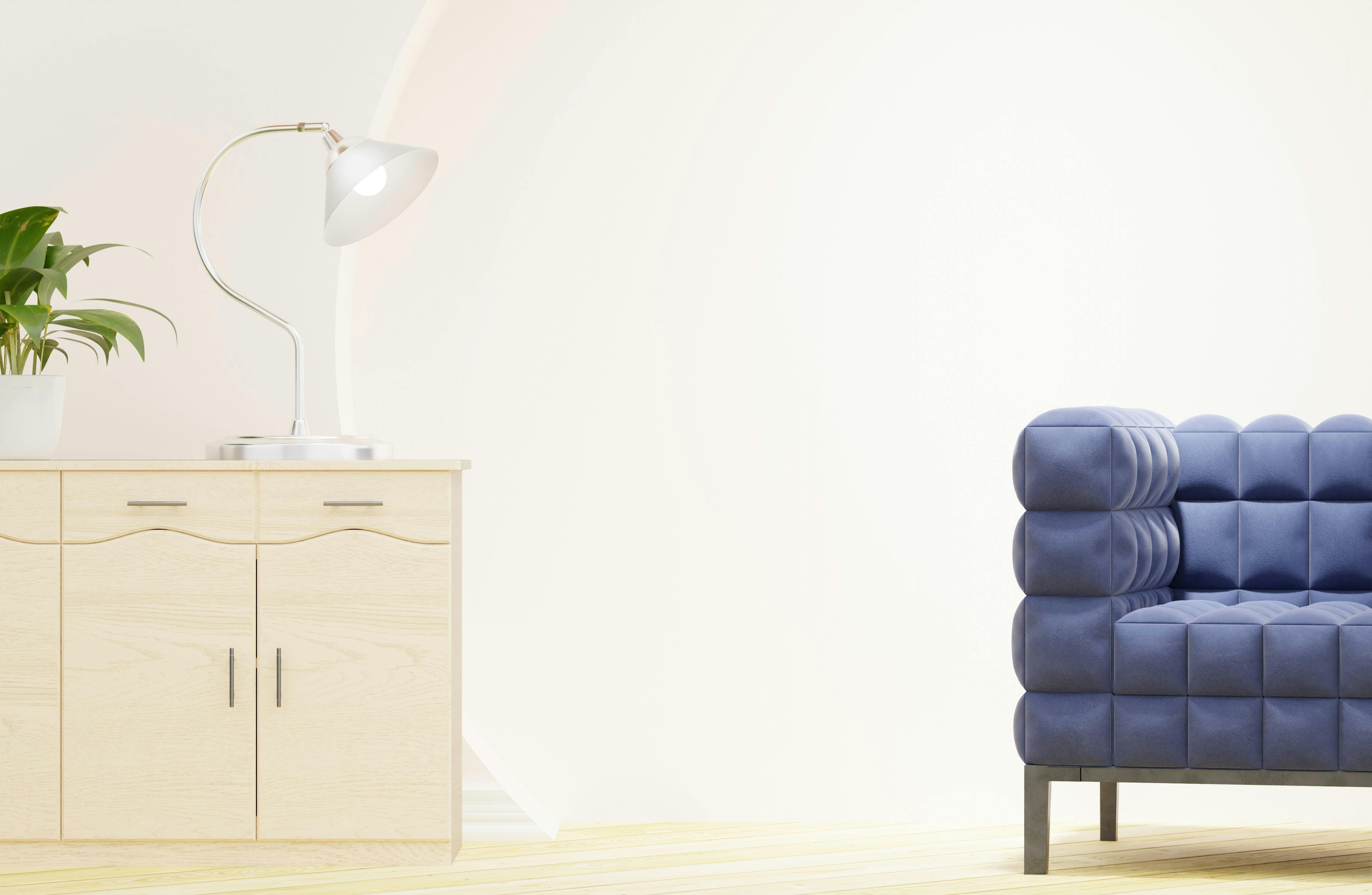 Salon w stylu skandynawskim z tapczanem i pojemnikiem na pościel w jasnej tkaninie