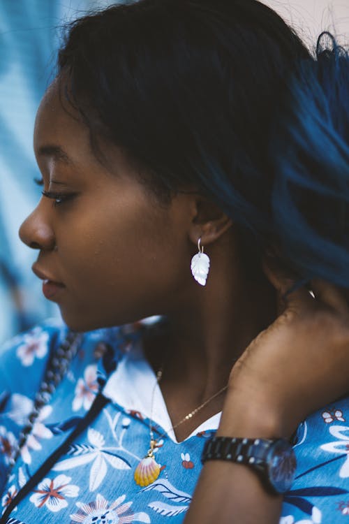 Woman Wearing Silver-colored Leaf Pendant Earrings