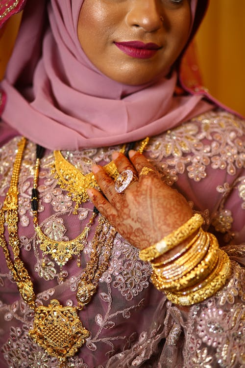 Woman Wearing Traditional Wedding Dress, Jewelry and a Hijab 