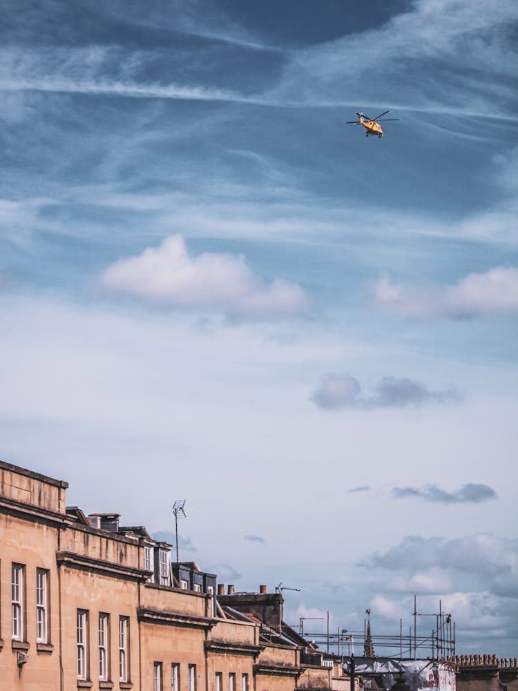 Helicopter Flying Over City