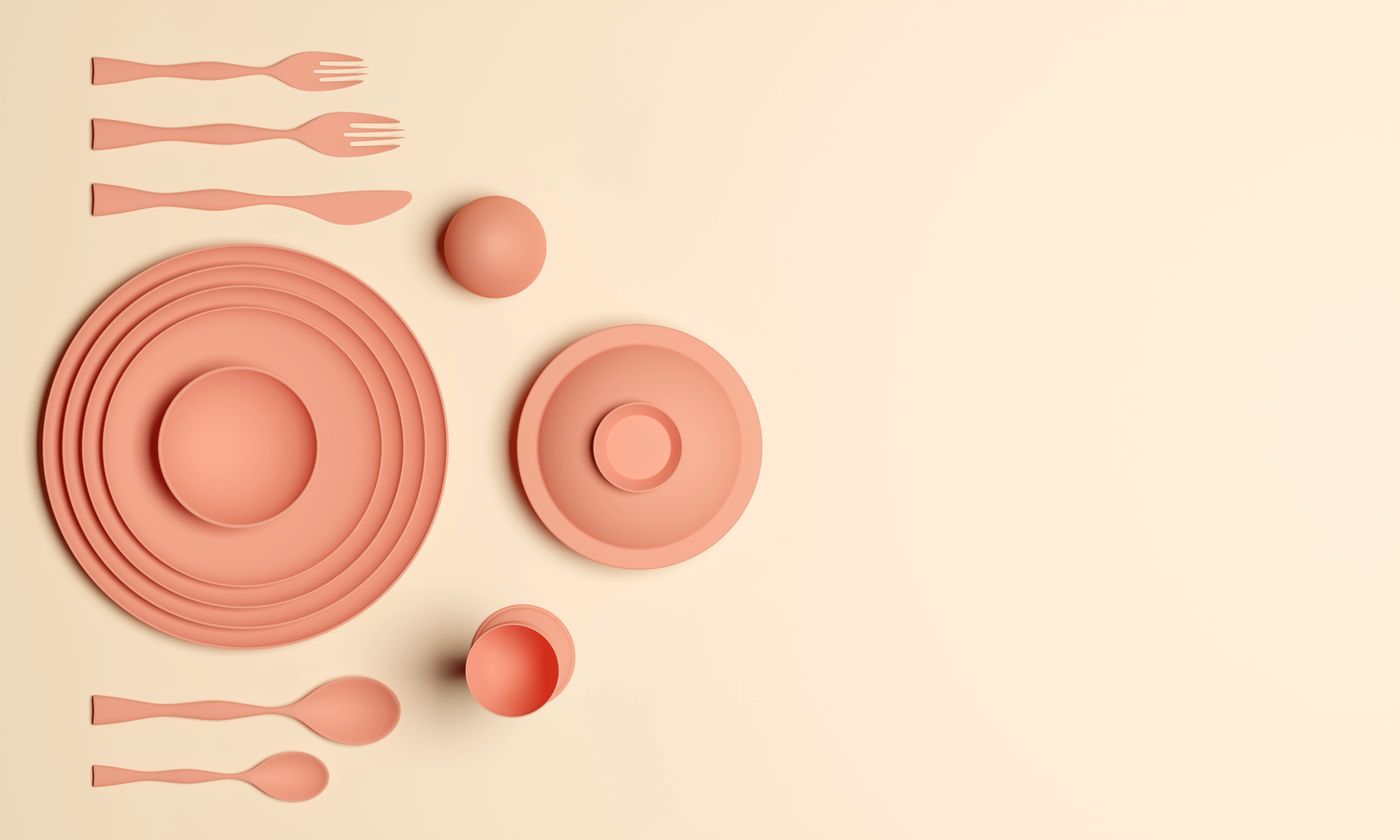 Elegant flat lay of coral dinnerware on a beige background, showcasing minimalist design.